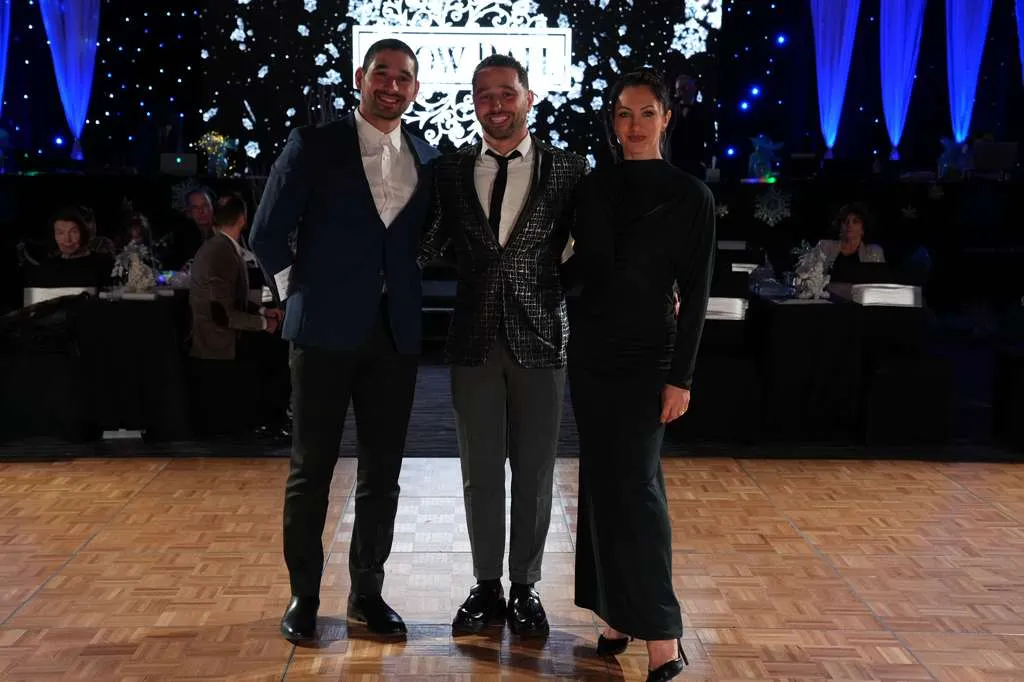 Dance event hosts on a ballroom floor