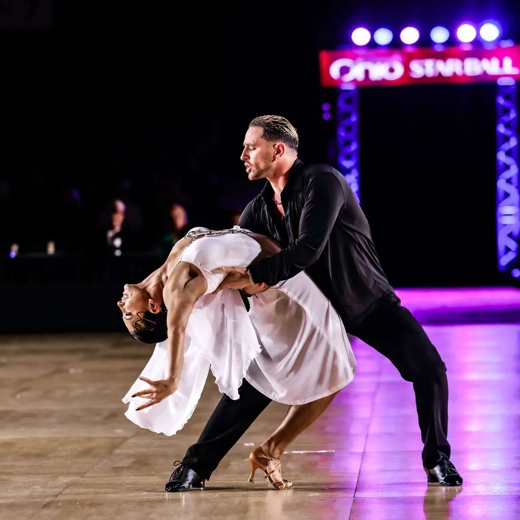 Gene and Elena Bersten performing a dramatic dance dip