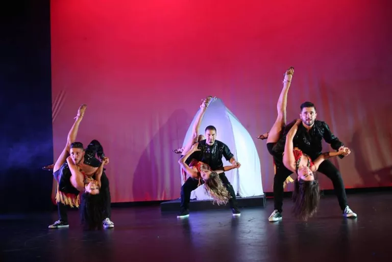 Dance With Love performers presenting a ballroom number on stage